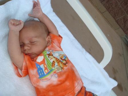 8-2-07danielloungingbythepoolweb.jpg